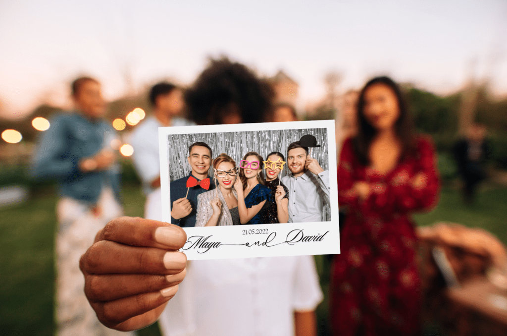 man holding photo in hand