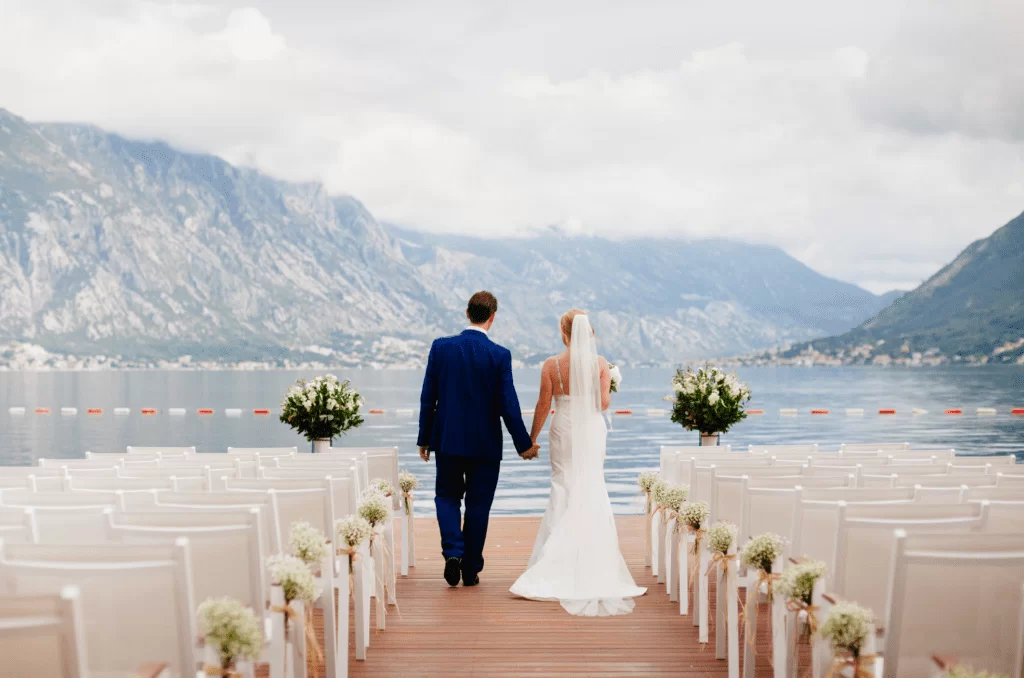 wedding couple on the lake holding hands